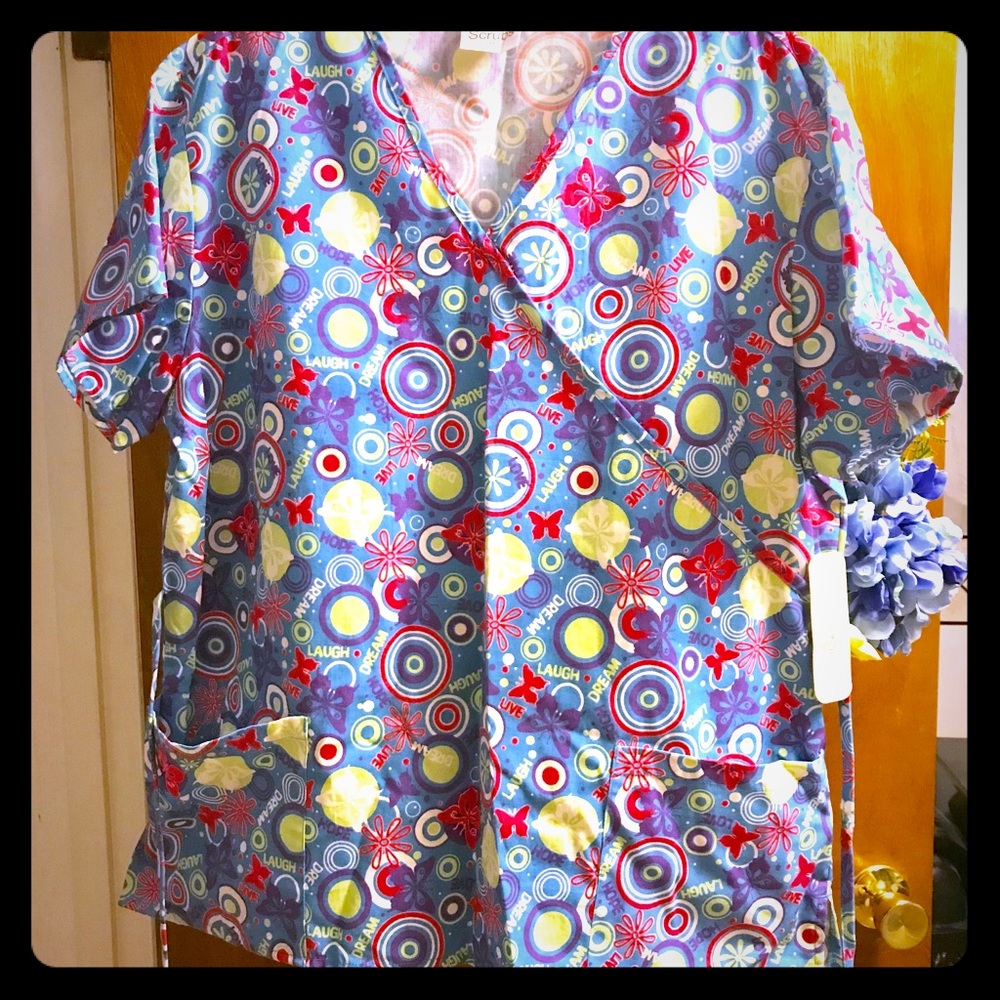 Brightly patterned new scrub top. Size 1x.